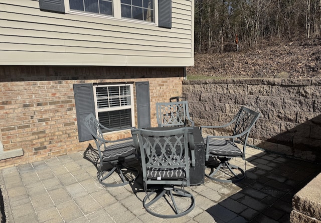 view of patio featuring outdoor dining area