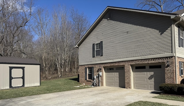 view of home's exterior featuring concrete driveway, brick siding, an attached garage, and a storage unit