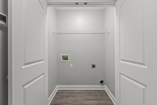 washroom with hookup for an electric dryer, washer hookup, and hardwood / wood-style floors