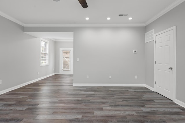 empty room with crown molding, dark hardwood / wood-style flooring, and ceiling fan