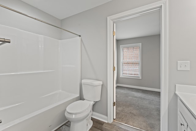 full bathroom with bathing tub / shower combination, vanity, and toilet