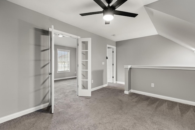 additional living space with carpet floors, ceiling fan, and lofted ceiling