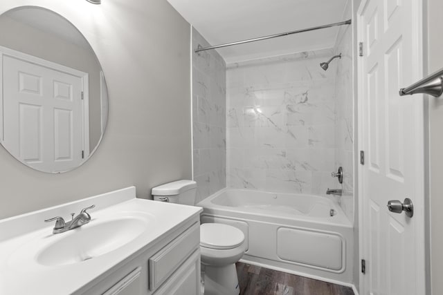 full bathroom with hardwood / wood-style floors, vanity, shower / bath combination, and toilet