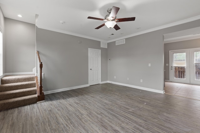 empty room with ceiling fan, dark hardwood / wood-style flooring, and crown molding