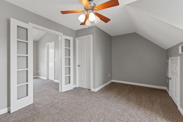 bonus room with carpet flooring, built in features, ceiling fan, and lofted ceiling