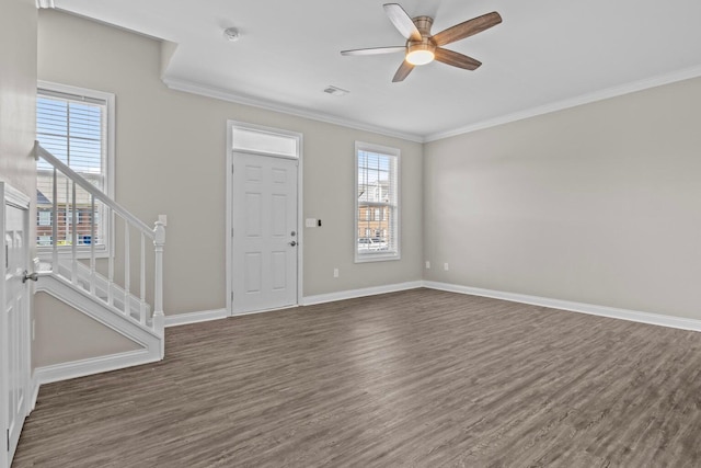 entrance foyer with ceiling fan, dark hardwood / wood-style floors, and ornamental molding