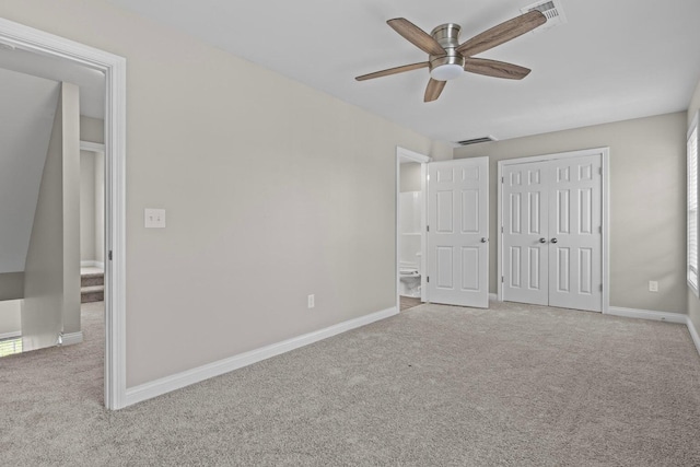 unfurnished bedroom featuring light colored carpet and ceiling fan