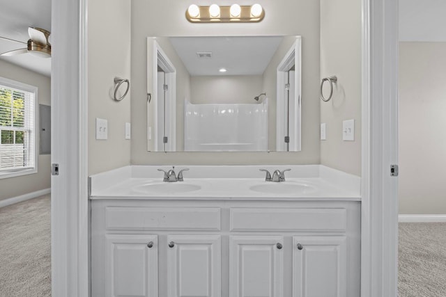 bathroom with vanity and a shower