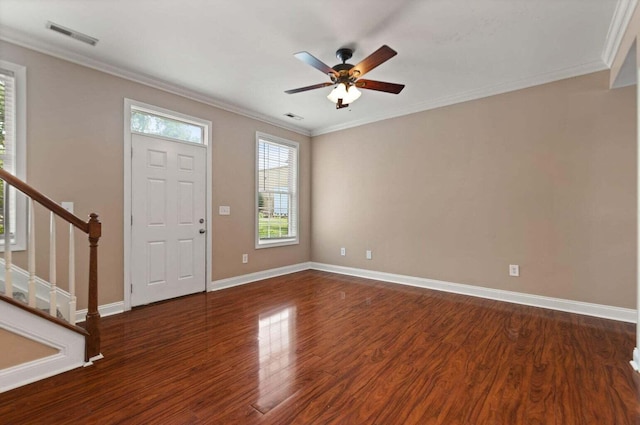 foyer entrance featuring ceiling fan, crown molding, and dark wood-type flooring