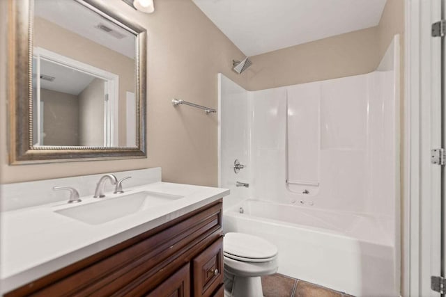 full bathroom with tile patterned flooring, vanity, shower / bathtub combination, and toilet