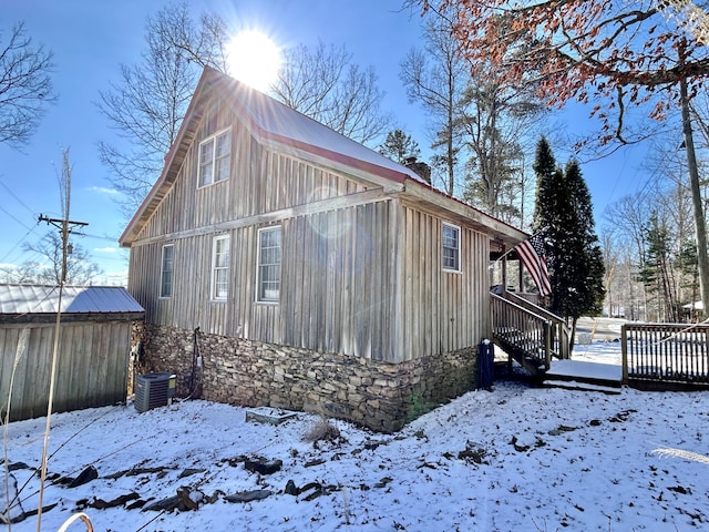 exterior space featuring a wooden deck and cooling unit