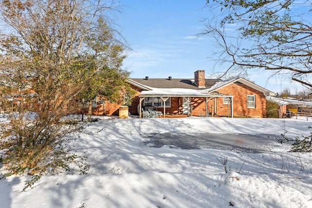 view of snow covered house