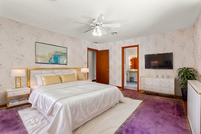 bedroom with ensuite bath and ceiling fan