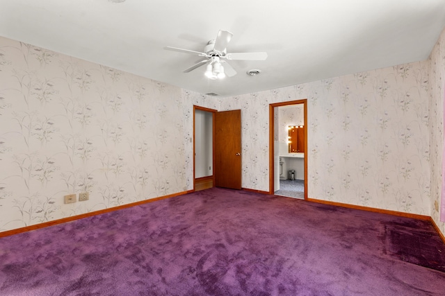 carpeted empty room featuring ceiling fan