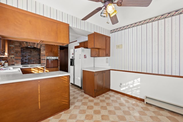 kitchen featuring white fridge with ice dispenser, wall oven, kitchen peninsula, ceiling fan, and a baseboard radiator