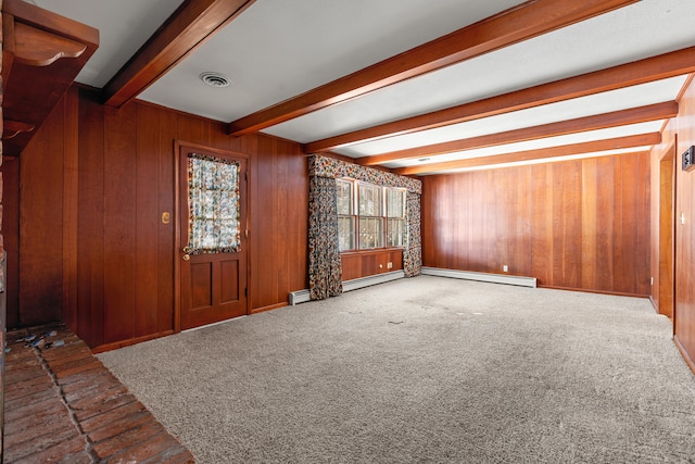 foyer entrance with beam ceiling, wooden walls, a baseboard radiator, and carpet