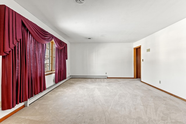 spare room with light colored carpet