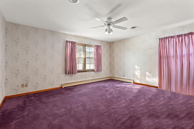 carpeted empty room featuring baseboard heating and ceiling fan