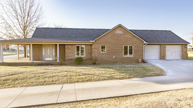 view of front facade with a garage and a front lawn