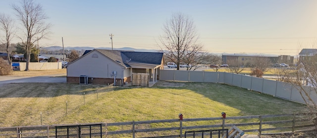 view of yard at dusk