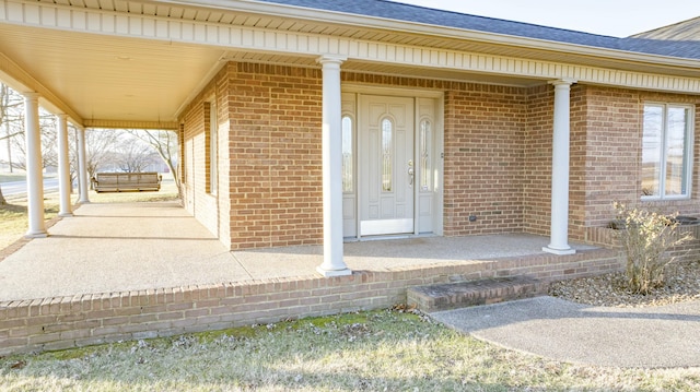 entrance to property featuring a porch