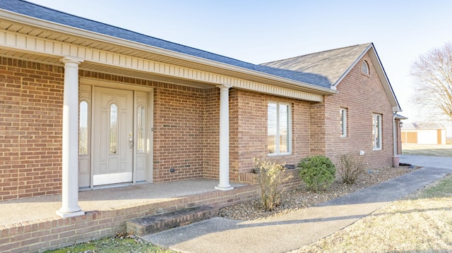 doorway to property with a porch