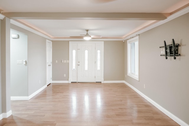 entrance foyer with ceiling fan, ornamental molding, and light hardwood / wood-style flooring