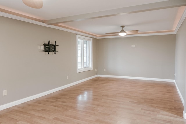 empty room featuring crown molding, ceiling fan, and light wood-type flooring