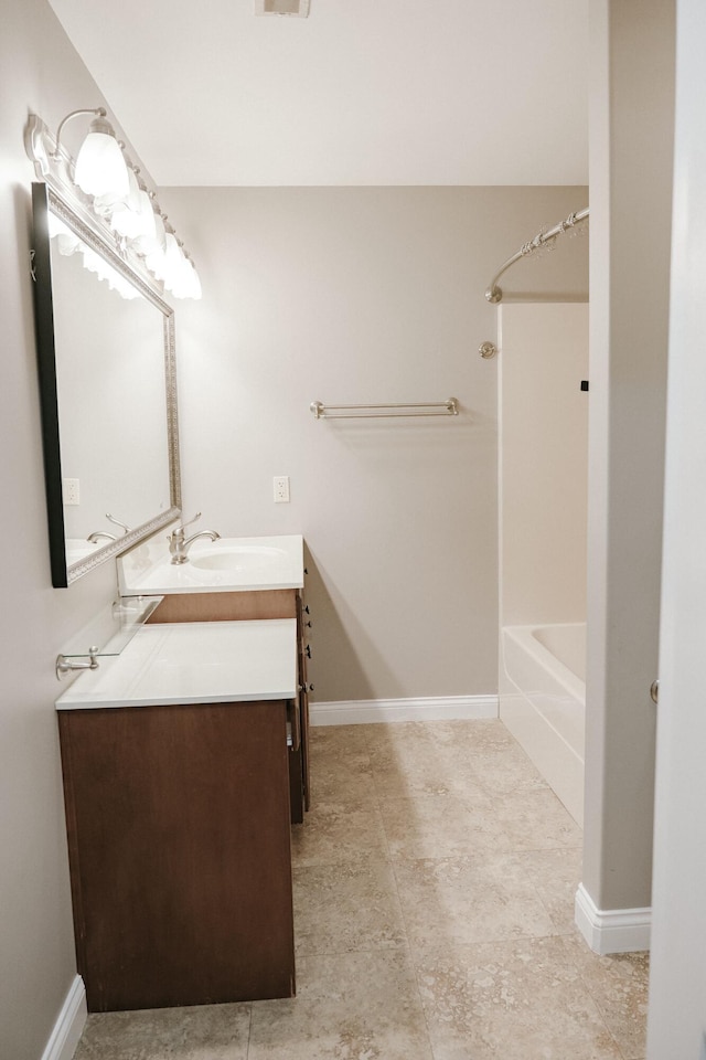 bathroom with vanity and shower / washtub combination