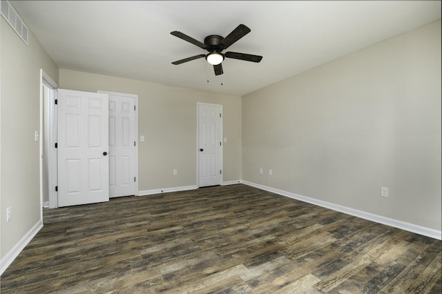 unfurnished bedroom with dark hardwood / wood-style floors and ceiling fan