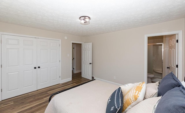 bedroom with a textured ceiling, a closet, wood finished floors, and baseboards