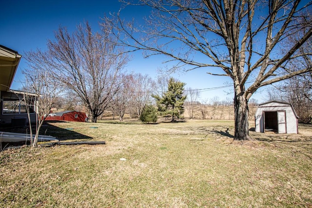 view of yard with a storage shed and an outdoor structure