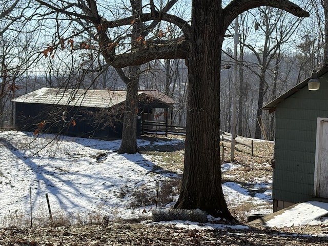 view of yard layered in snow