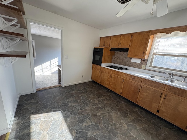 kitchen with sink, ceiling fan, tasteful backsplash, and black appliances