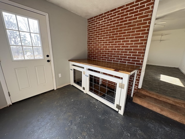 unfurnished living room featuring ceiling fan, heating unit, and a textured ceiling