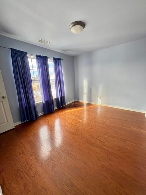 empty room featuring wood-type flooring