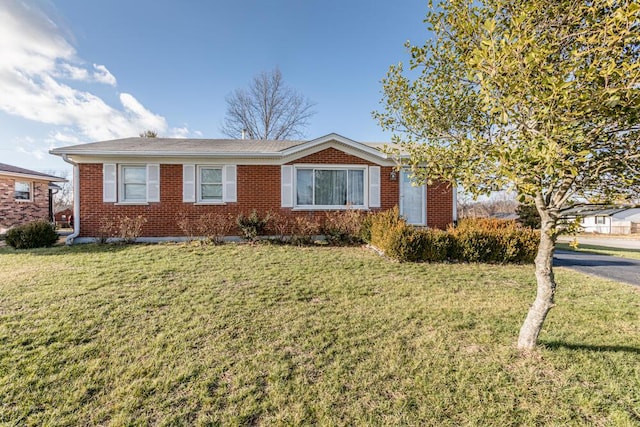 ranch-style house with a front lawn