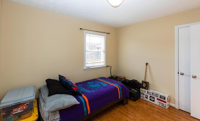 bedroom featuring hardwood / wood-style flooring