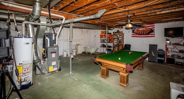 basement featuring ceiling fan, gas water heater, and billiards