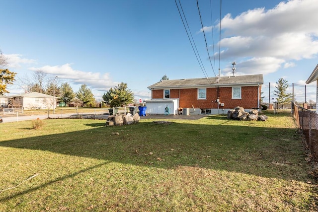 back of house with a yard