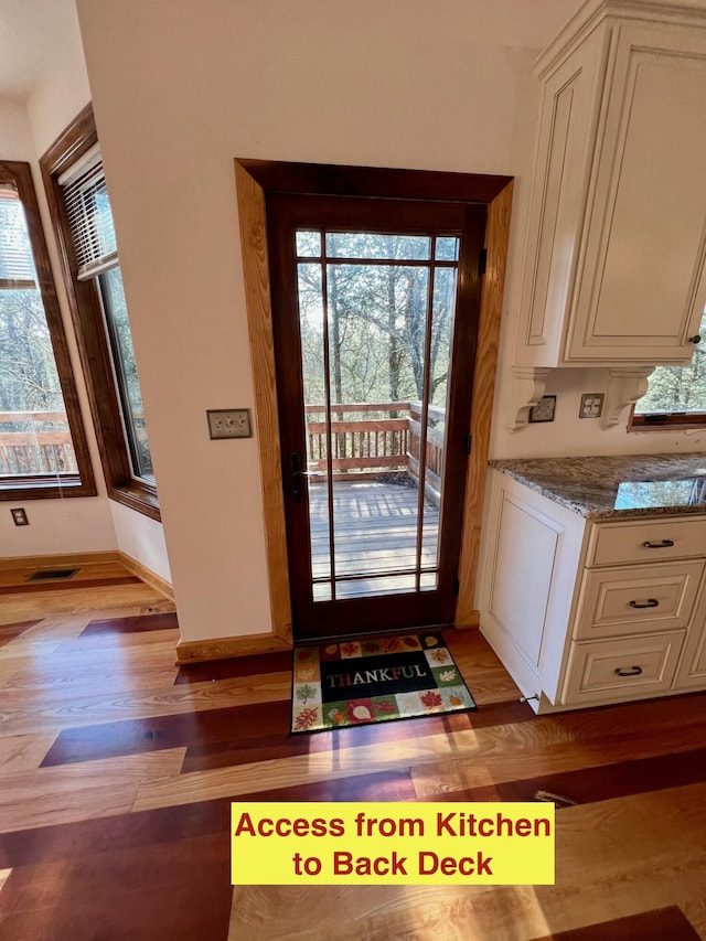 doorway to outside featuring light hardwood / wood-style floors