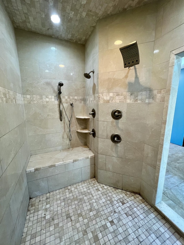 bathroom with tiled shower