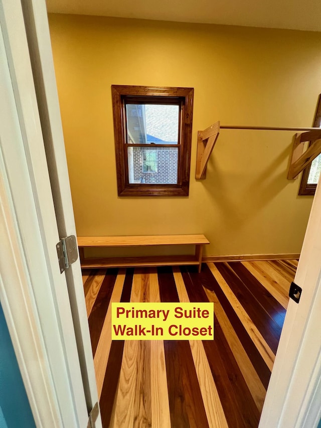 stairway with hardwood / wood-style flooring