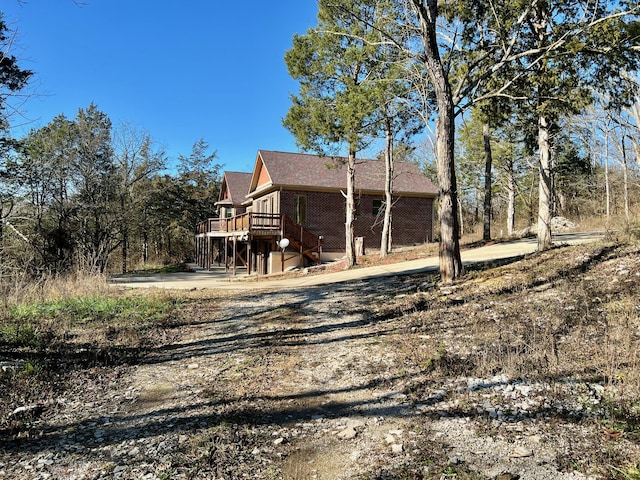 view of side of property with a deck