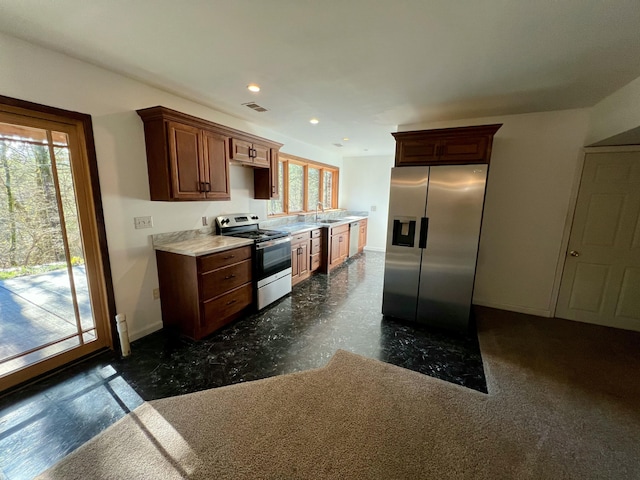 kitchen with plenty of natural light, sink, and stainless steel appliances