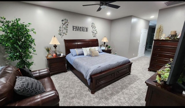 carpeted bedroom featuring ensuite bathroom and ceiling fan