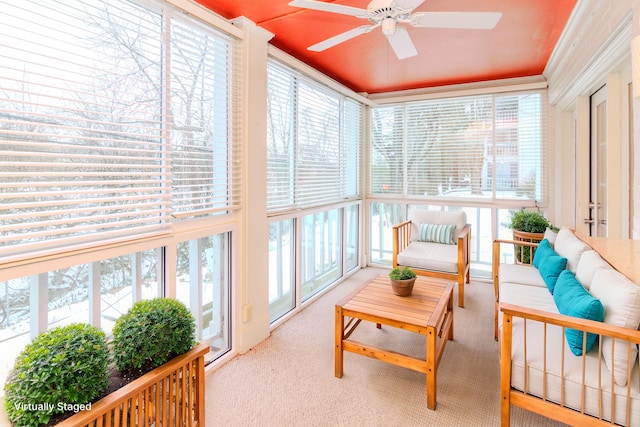 sunroom / solarium with a wealth of natural light and ceiling fan