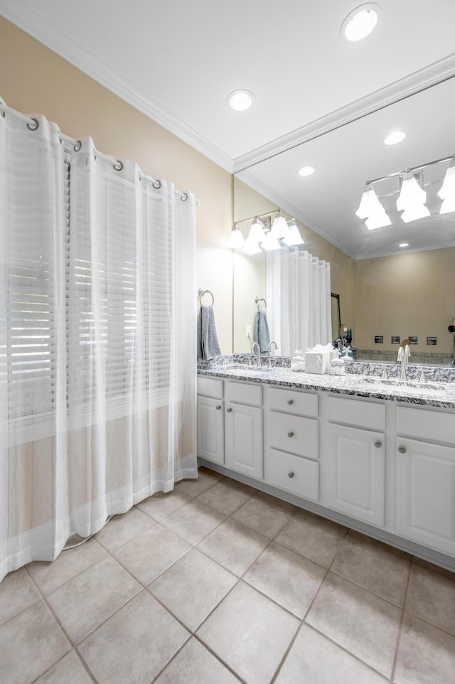 bathroom with tile patterned flooring, vanity, and ornamental molding