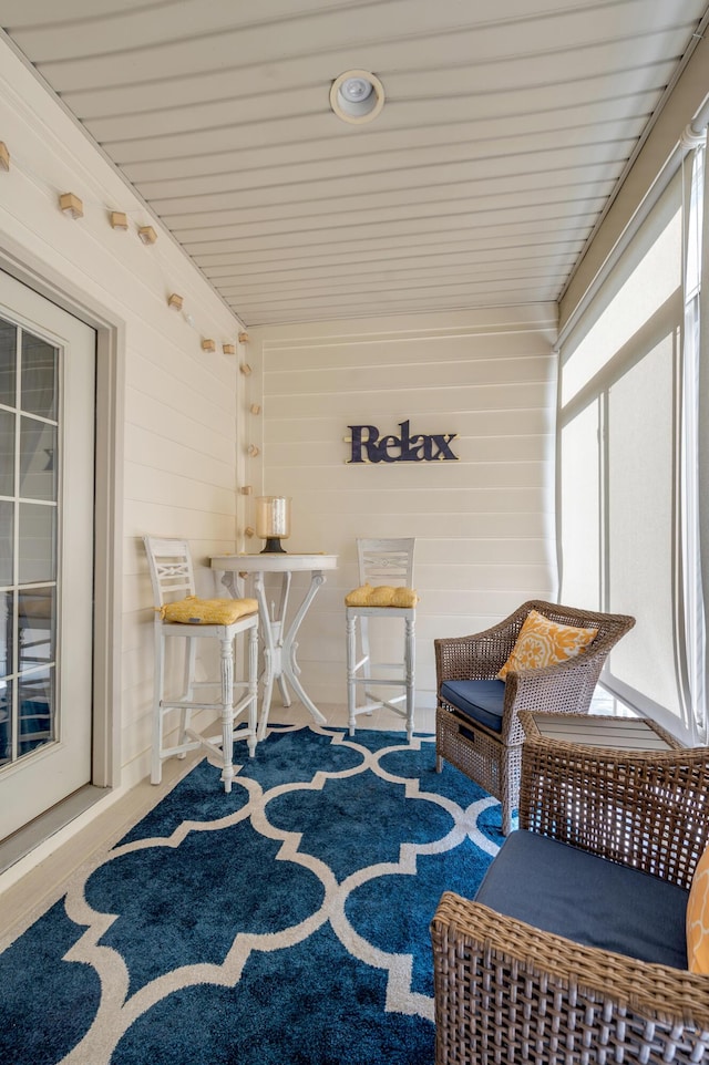 sunroom / solarium featuring a healthy amount of sunlight