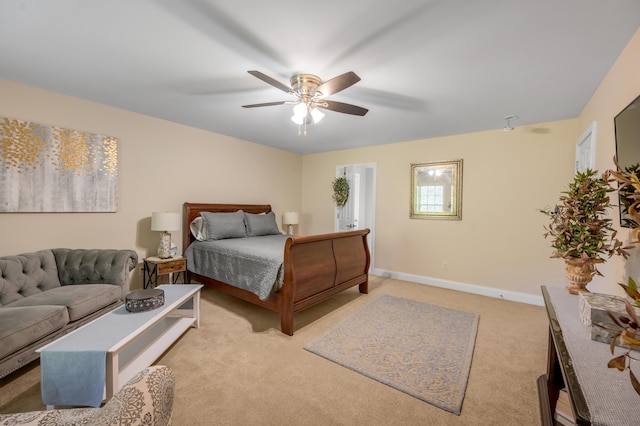 bedroom featuring light colored carpet and ceiling fan